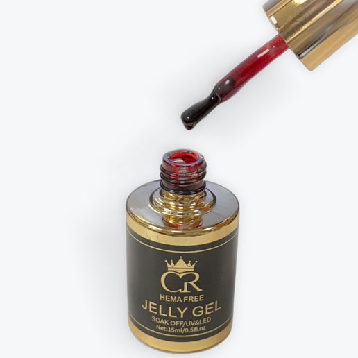 Jelly Gel bottle with applicator dripping red gel onto a white background