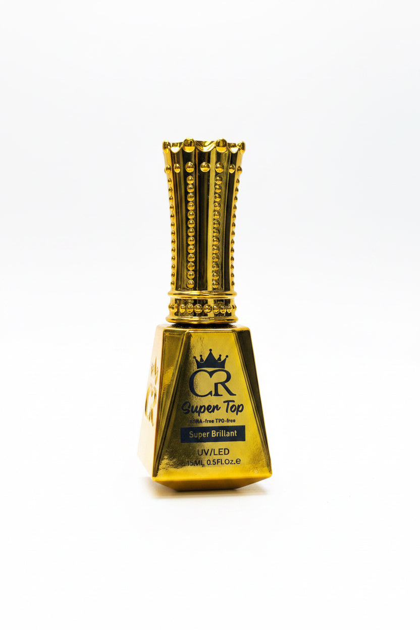 A bottle of CR Super Bright UV/LED nail polish with a gold cap and gold bottle, shown on a light wood surface against a gray background.