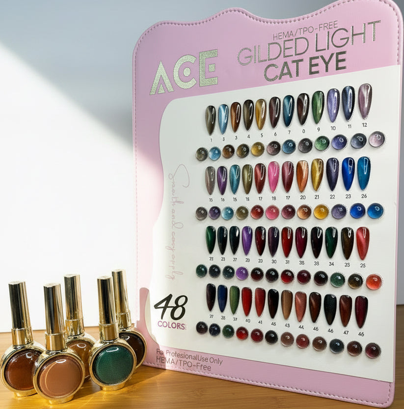 A pink ACE Gilded Light Cat Eye nail polish display card showing 48 color options, with several cat-eye nail polish bottles placed in front on a wooden surface against a light blue background.
