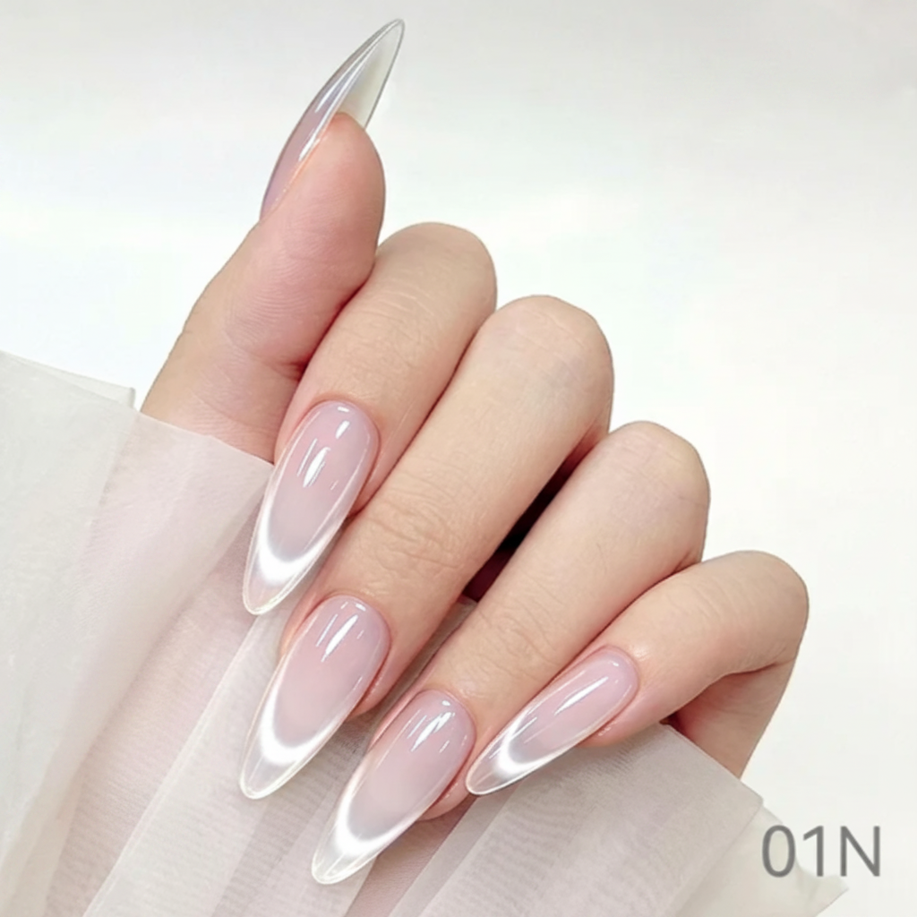 Hand with pink and white nail polish holding a bottle of nail care product, with 'Cre8tion' branding.