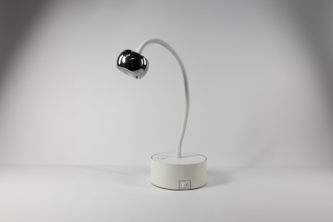 Modern wall-mounted light fixture on a plain wall