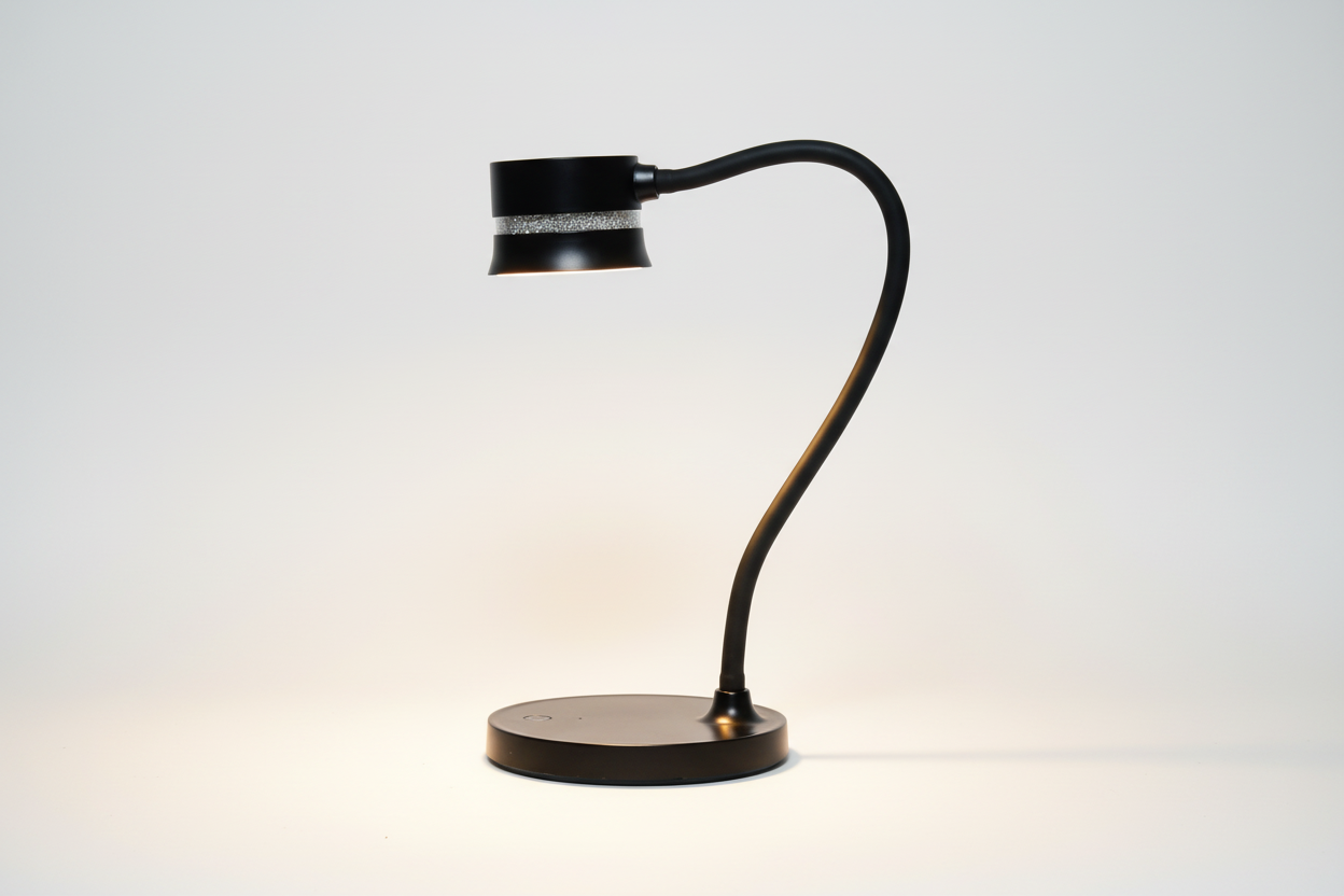 Black adjustable desk lamp on a white background