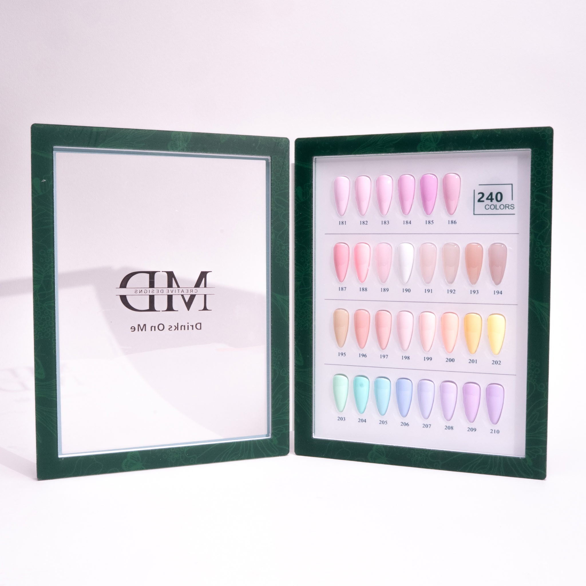 Open green box displaying a selection of nail polish colors with a brand logo on a white background.