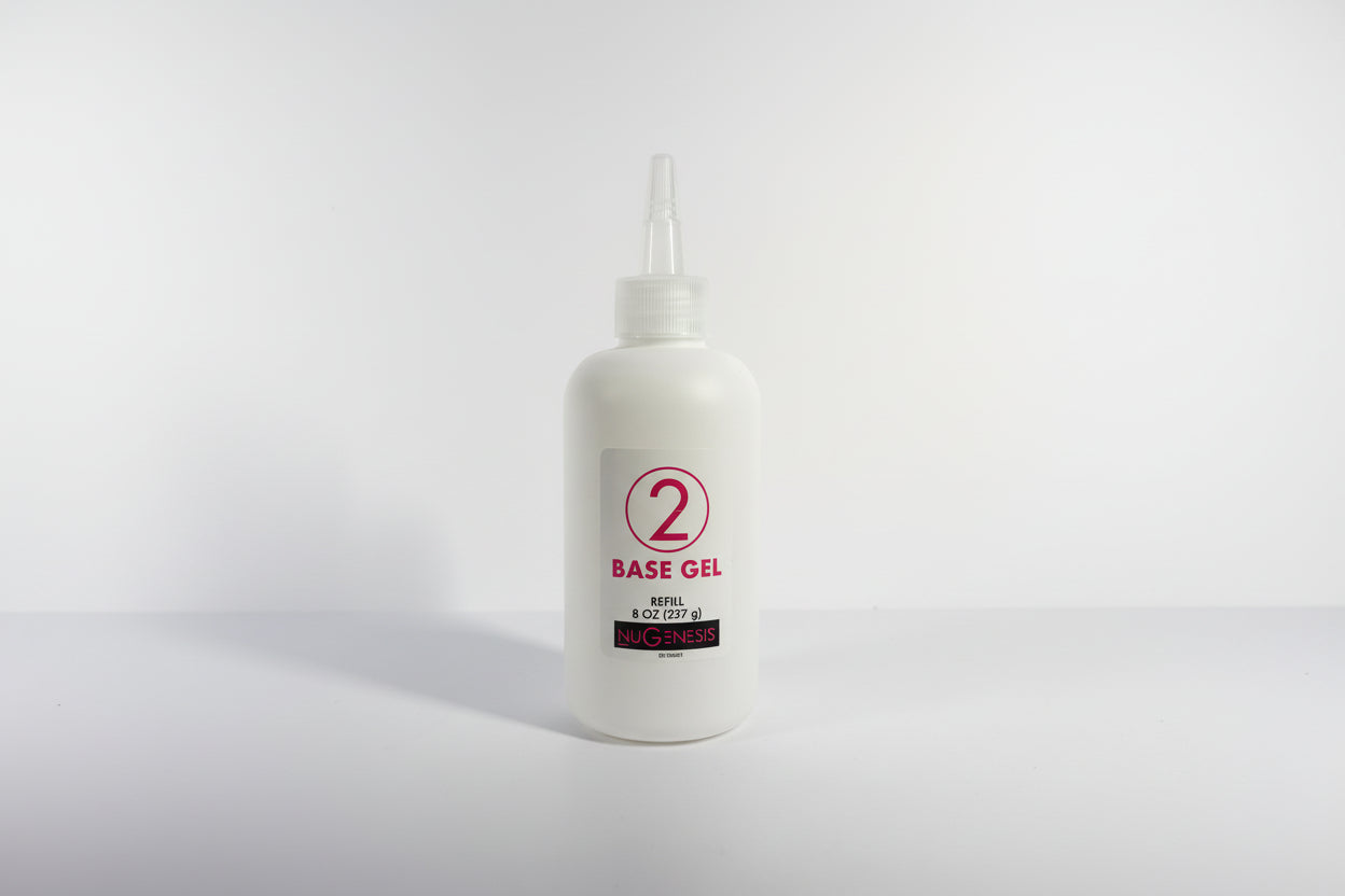 White bottle with red label on a white background