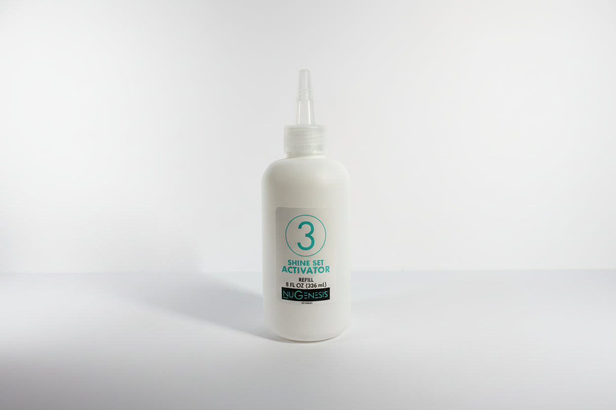 White bottle with a pump on a white background