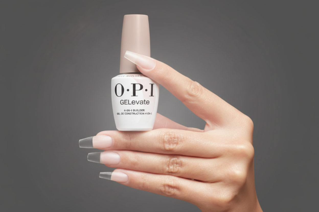 Hand holding a bottle of OPI GElevate nail polish with a gray background