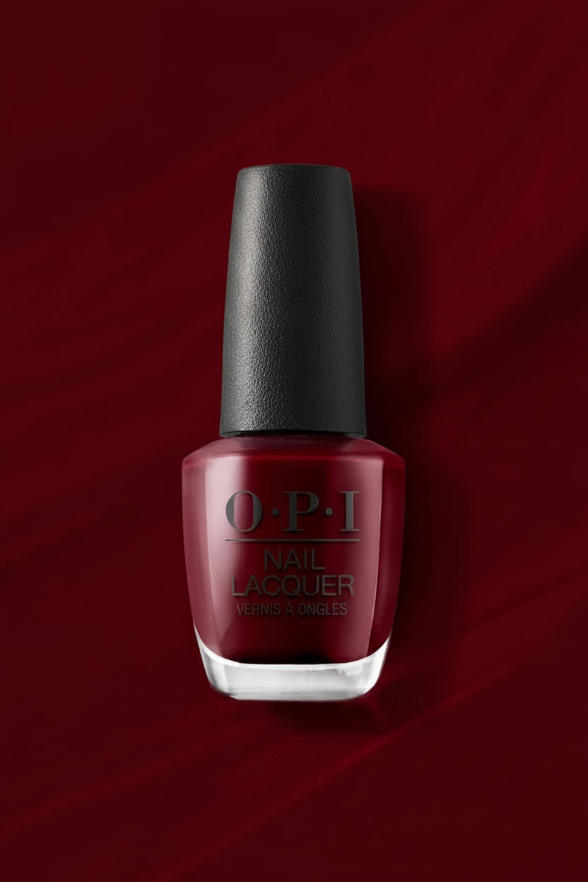 OPI nail polish bottle on a red background