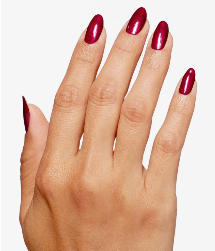Hand with red nail polish on a white background