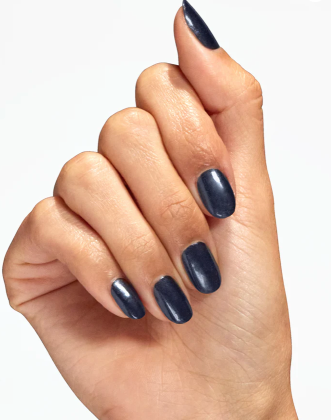 Hand with dark blue nail polish on a white background