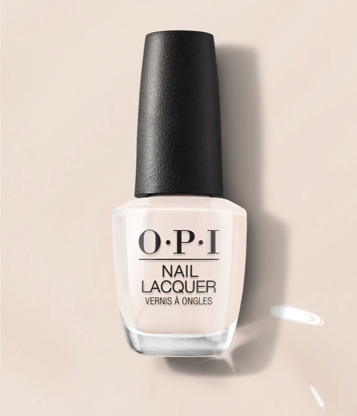 OPI nail polish bottle on a beige background