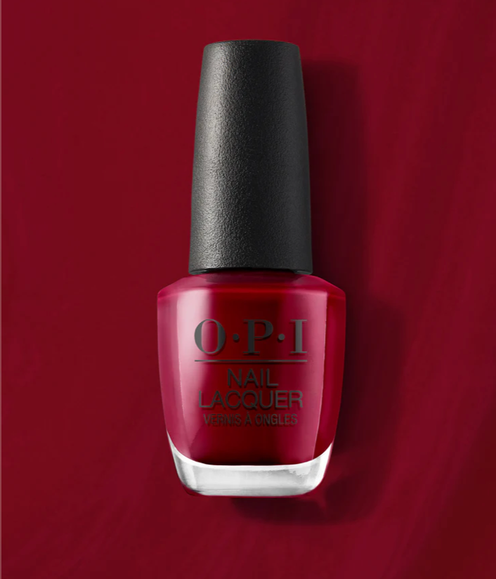 OPI nail polish bottle with black cap on a red background