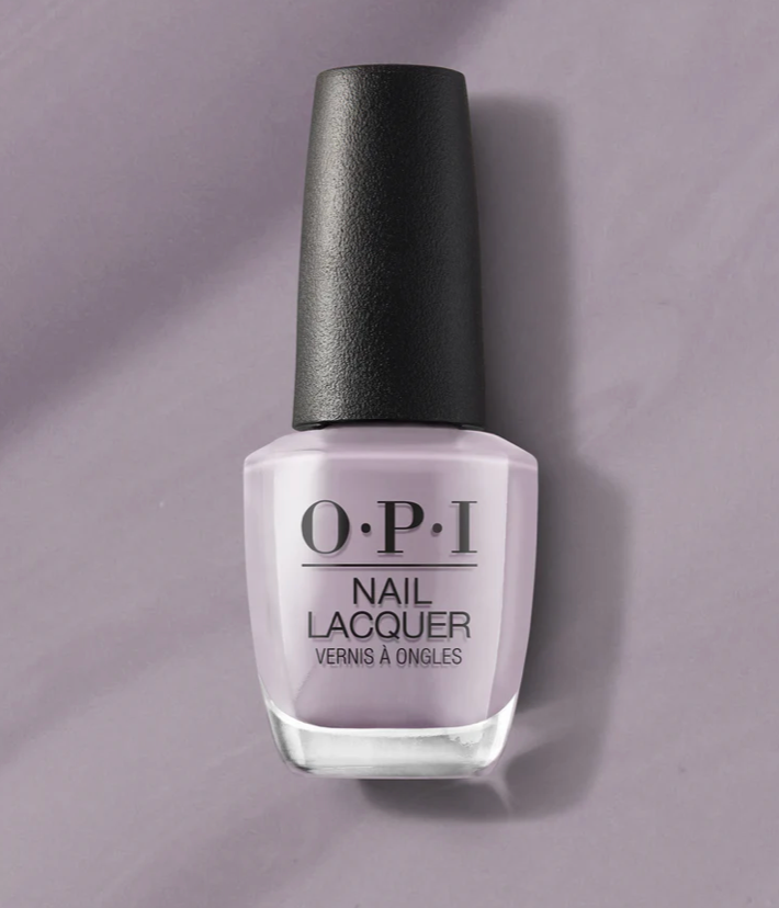 OPI nail polish bottle on a gray background