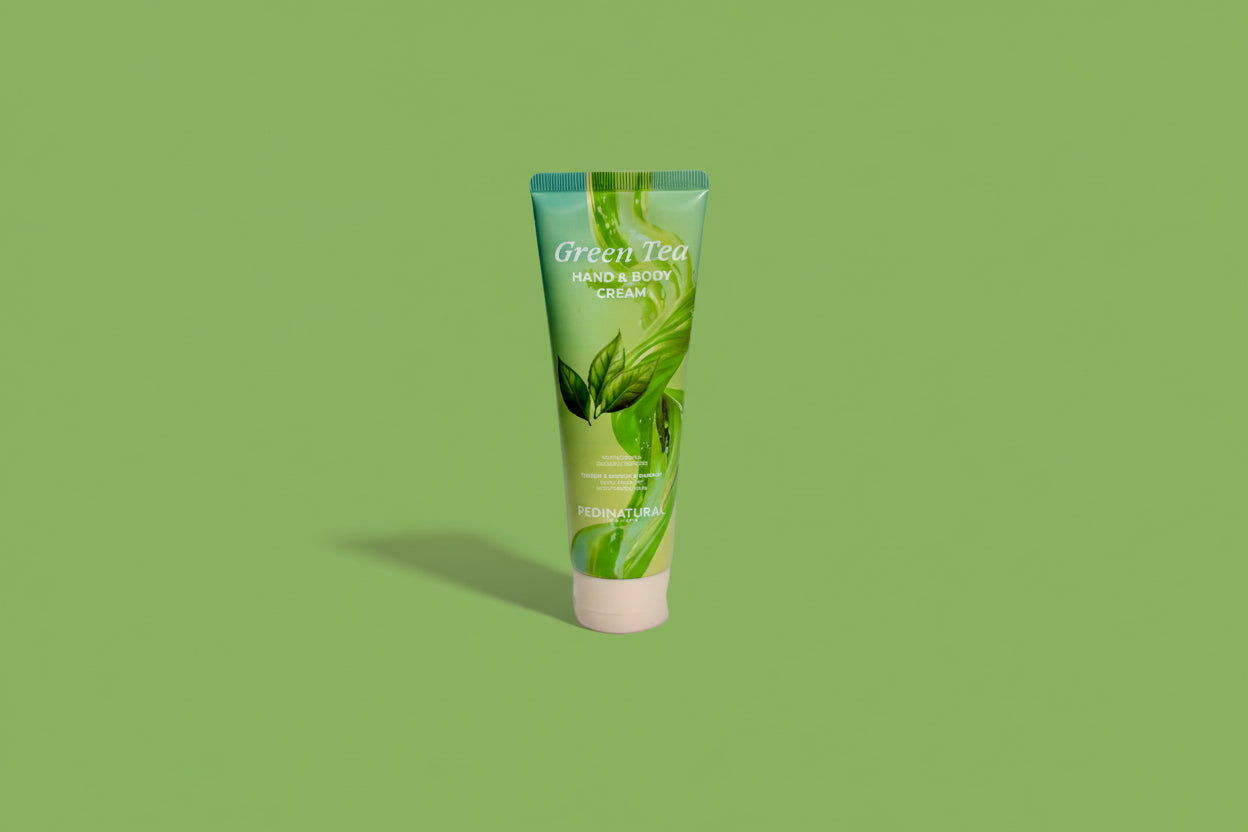Green Tea hand and body cream tube on a white background