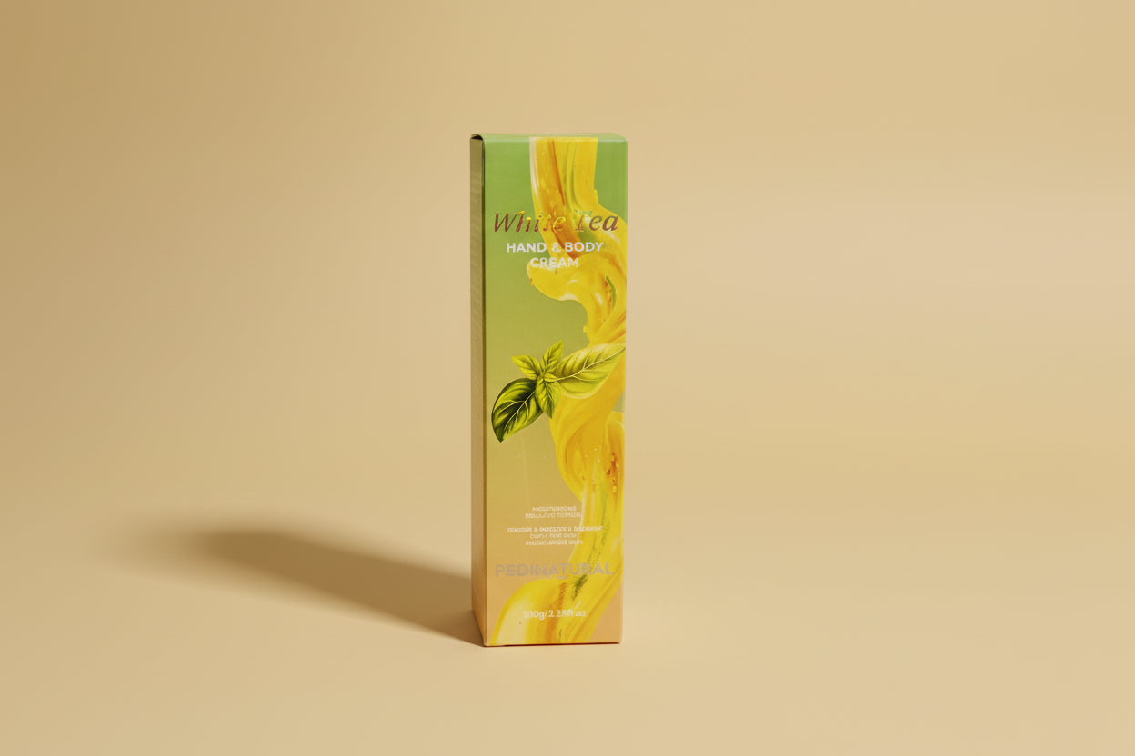 Box of White Tea Hand and Body Cream with a yellow floral design on a white background