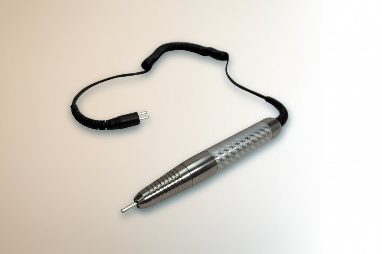 Metallic pen with a cord on a gray background