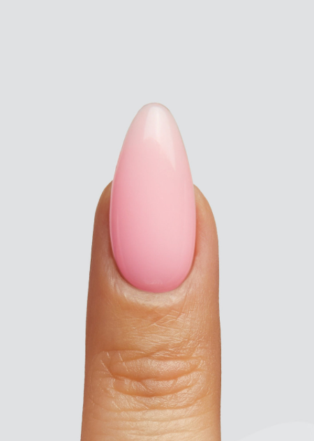 Nail with pink polish on a neutral background