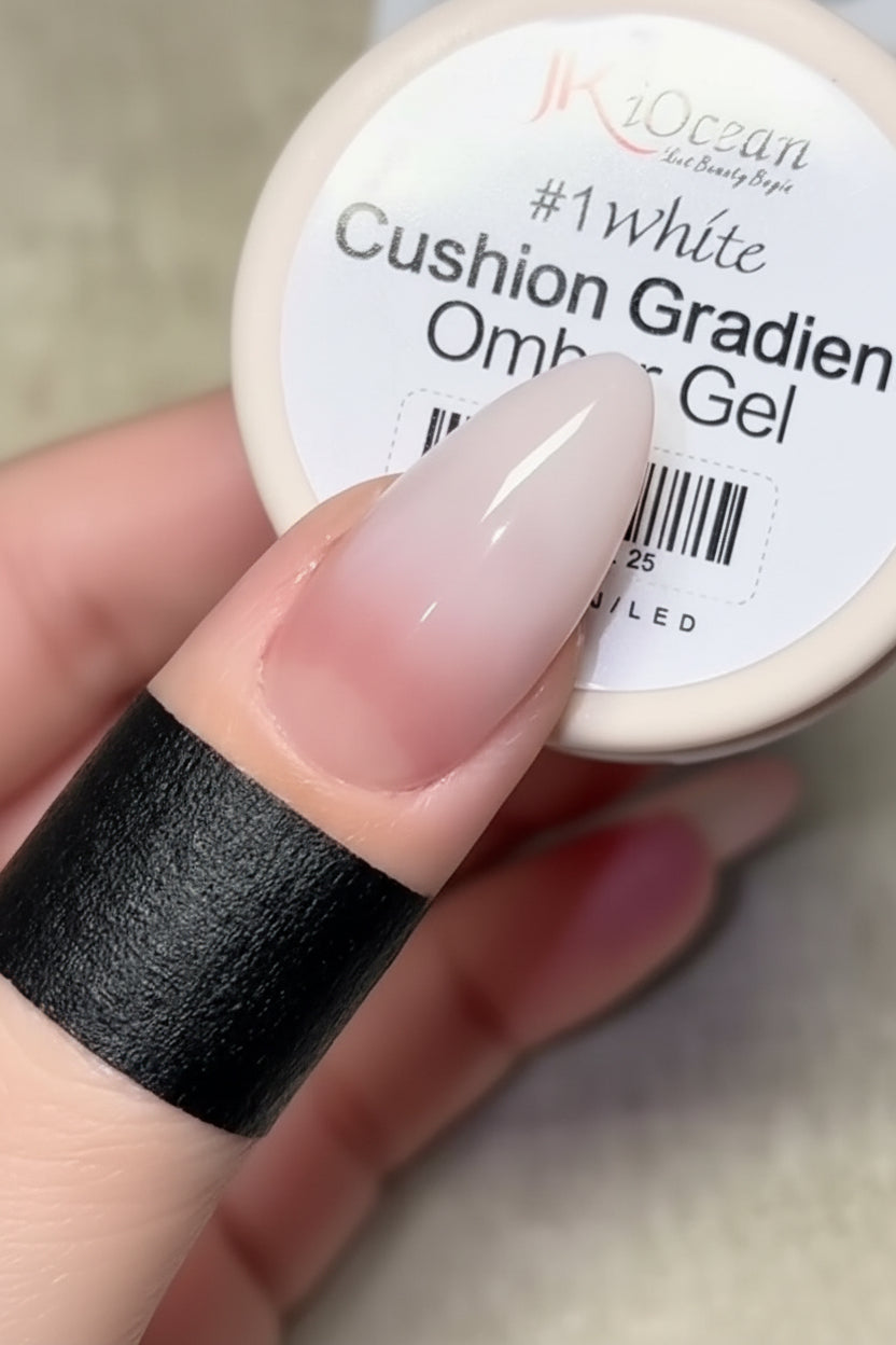 Cushion gradient omber gel with a hand holding it, showing a gradient from black to white.