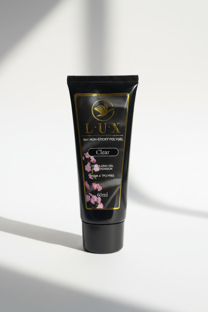 Black tube of Lux gel with gold accents on a white background