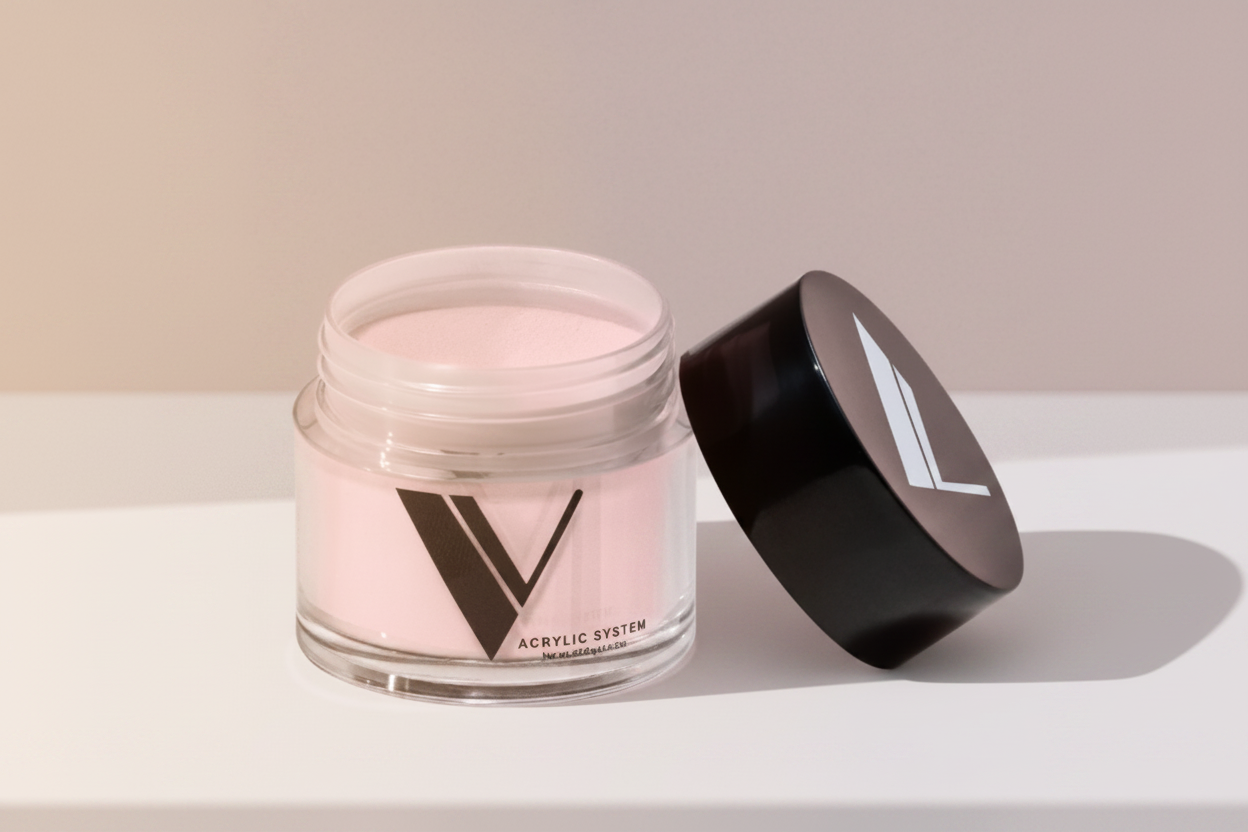 Jar of pink powder with a black lid on a light gray background