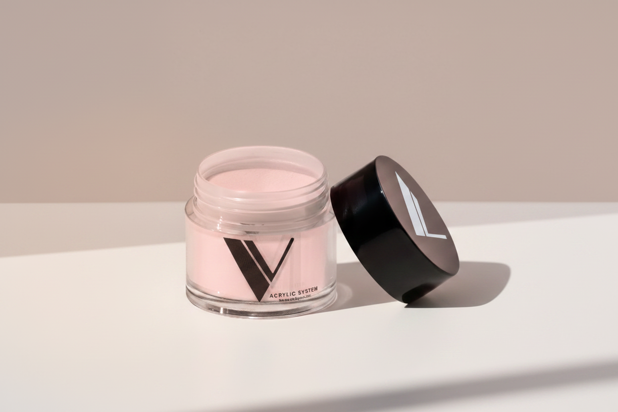 Jar of pink powder with a black lid on a light gray background