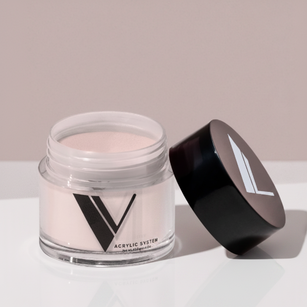 Jar of acrylic powder with a black lid on a neutral background